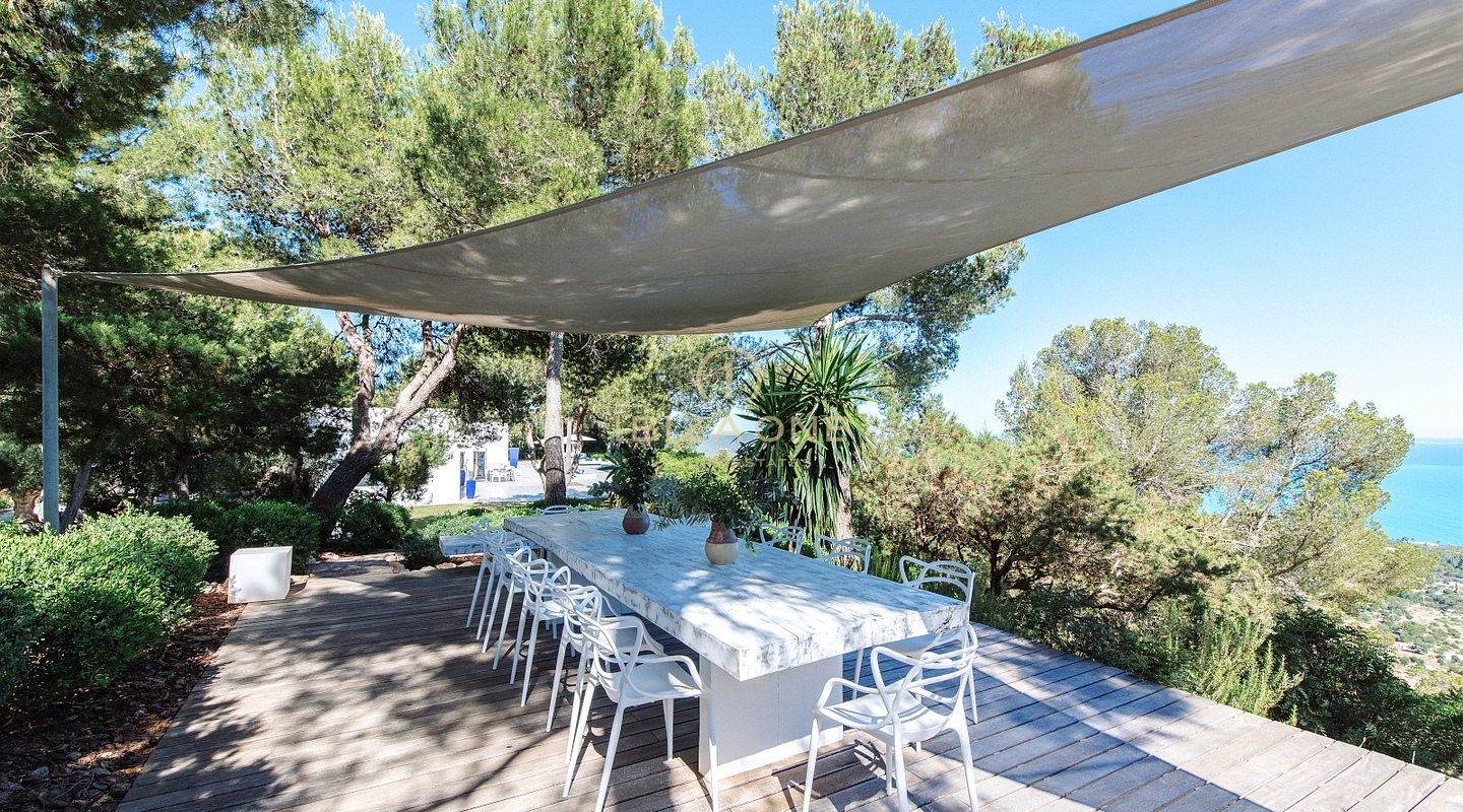 De luxe villa The Palms te huur - Ongeëvenaard uitzicht op zee en de baai vanaf de top van Es Cubells, Ibiza