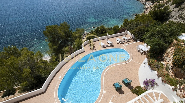Luxury first line sea villa in Es Cubells with direct access to the beach - waterfront property