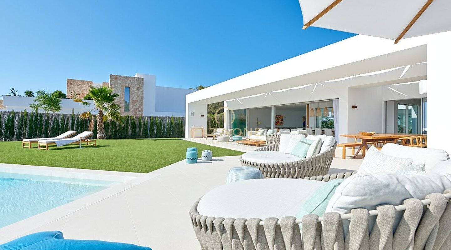 Modern newly built luxury villa with incredible sunset views and sea views in private urbanization for sale, Ibiza