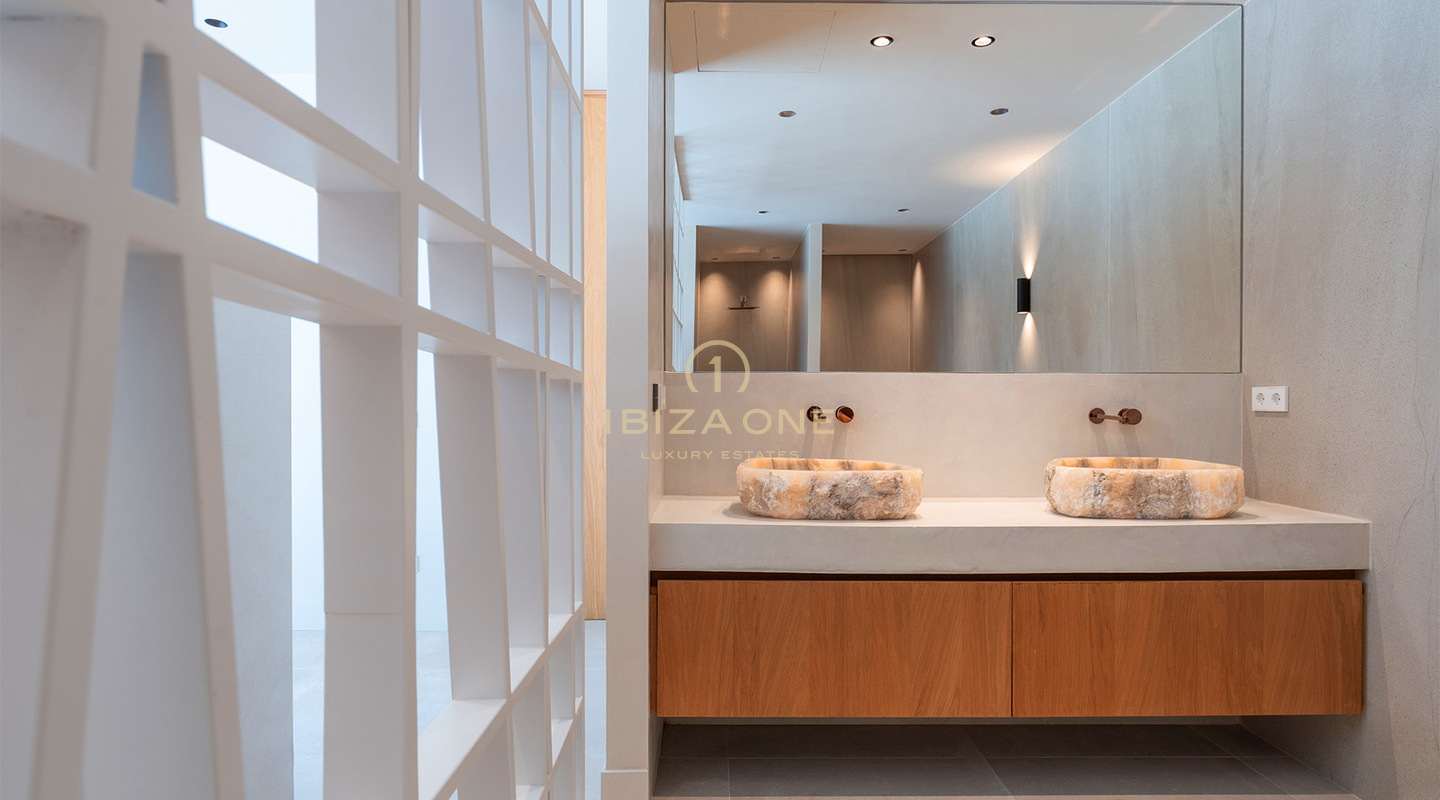 Villa de lujo de diseño a estrenar con vistas al mar, piscina privada y cocina Gaggenau en venta en Can Furnet, Ibiza.